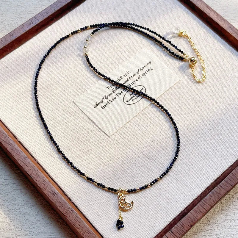 Close-up of a blue gold sand stone bracelet with three interlocking rings on a wrist.