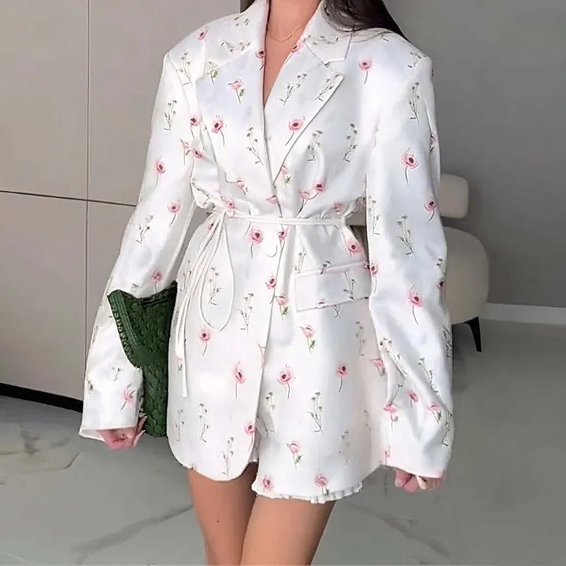 Polyester suit jacket with an adjustable lace-up collar at the waist, shown in a floral print colour option.