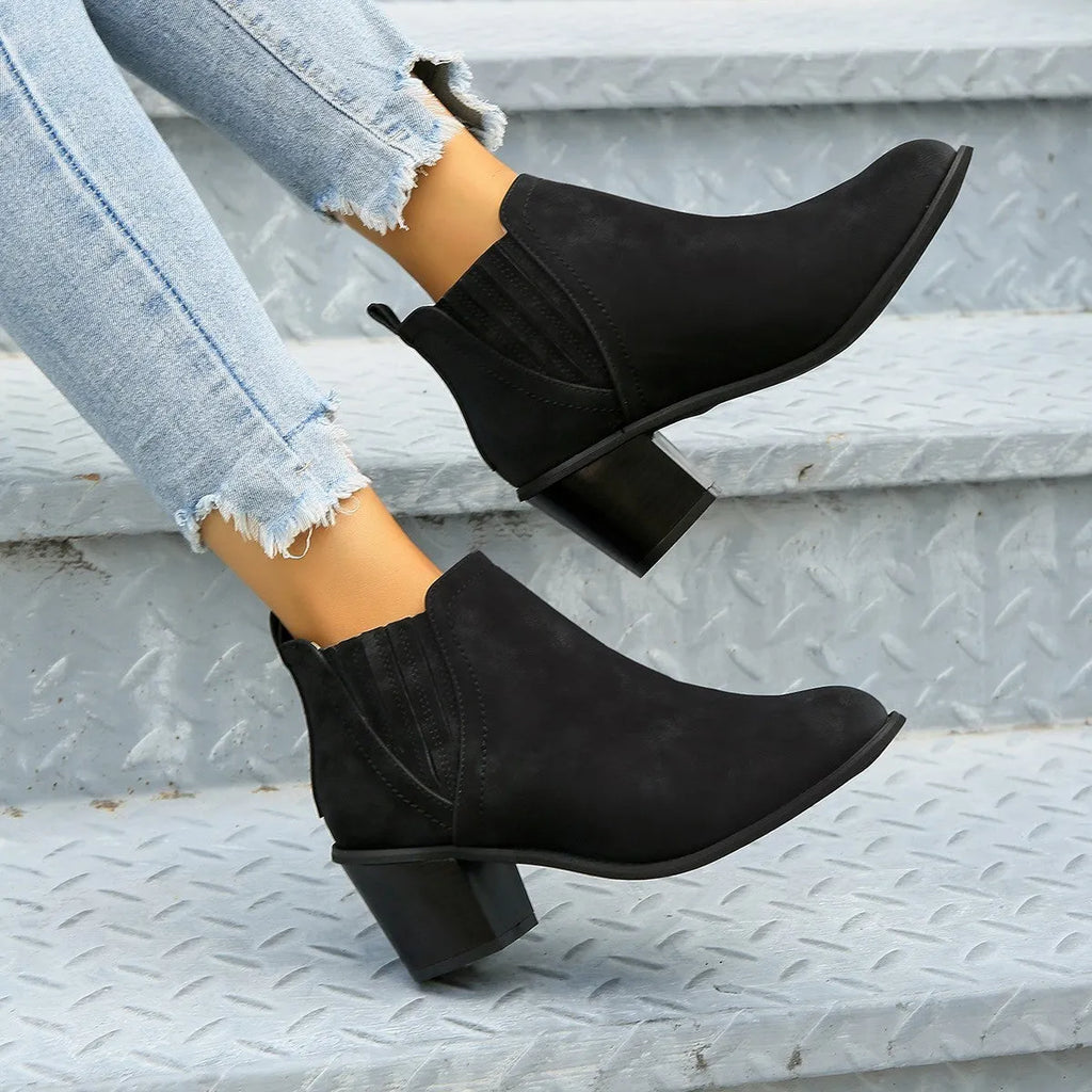 Women's black ankle boots with pointed toe and thick square heel slip-on design
