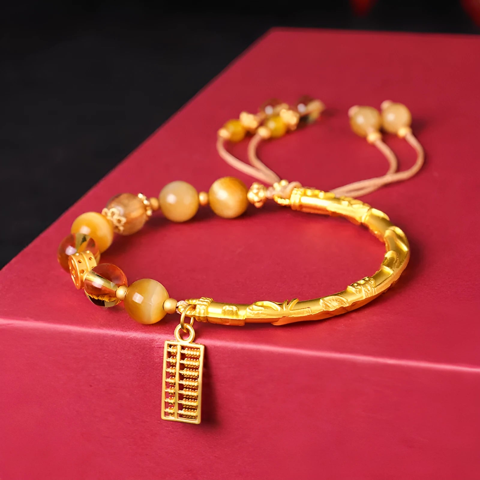 Women's abacus tag bracelet with tigereye and citrine beads and copper diamond-shaped tag