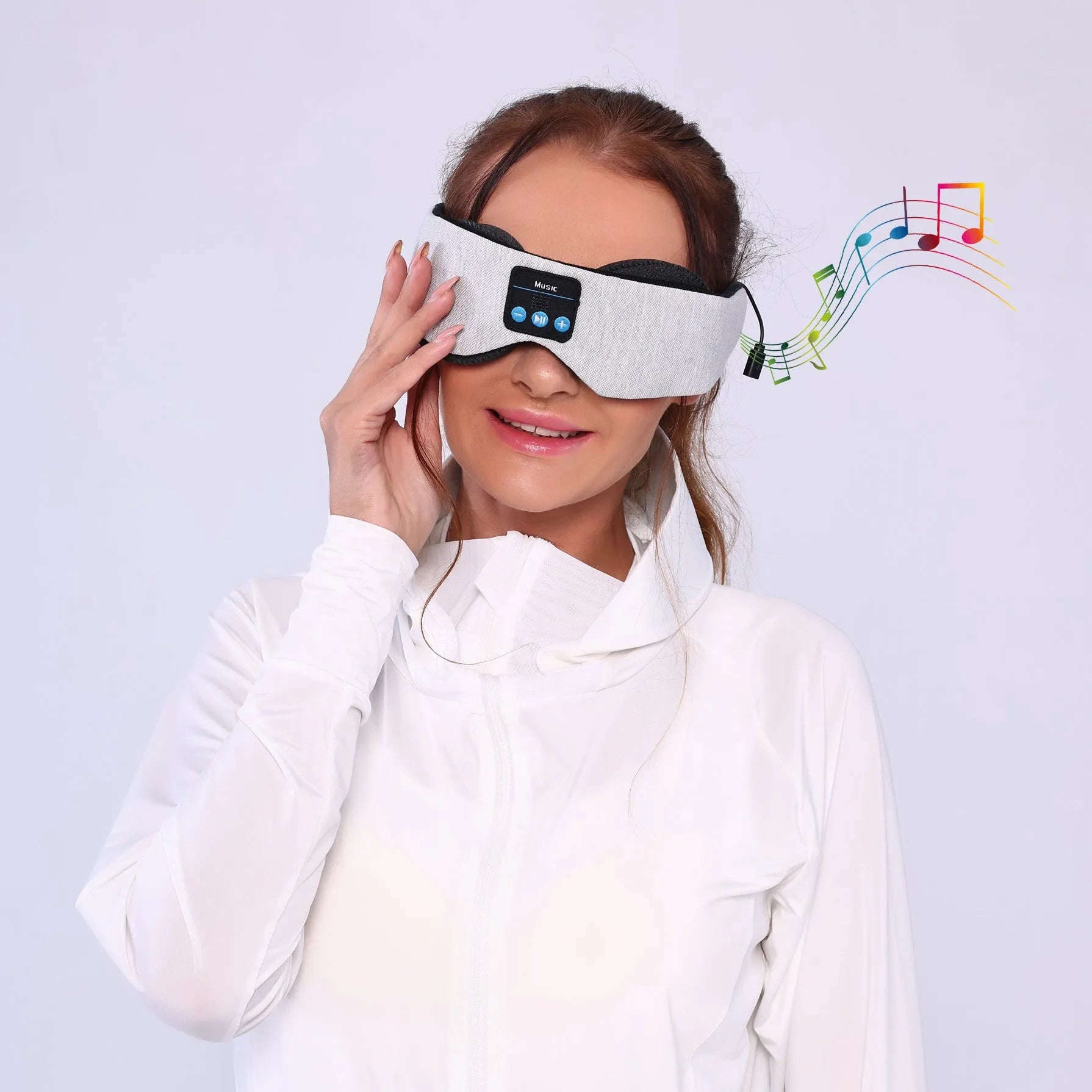 Grey outline Bluetooth sleeping eye mask with adjustable head strap on neutral background
