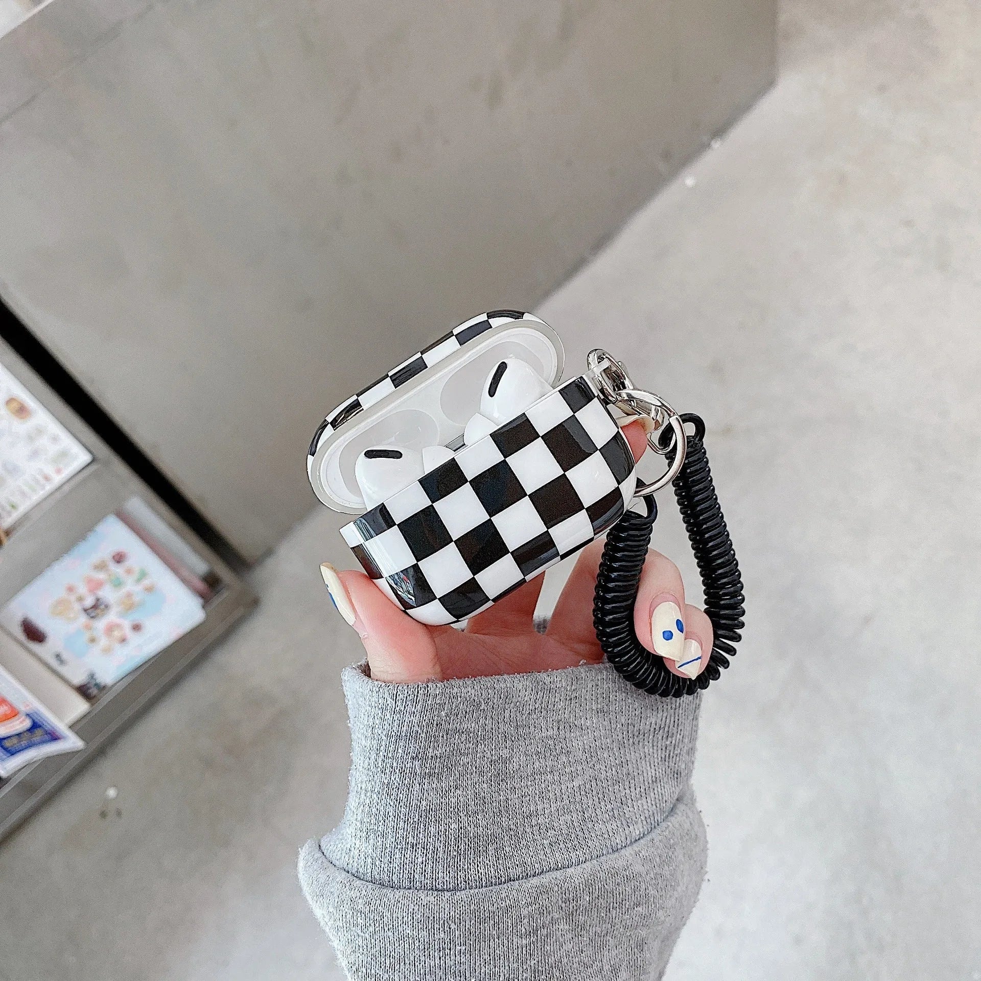 Black and green checkerboard pattern TPU case for Apple AirPods with optional pendant attachments