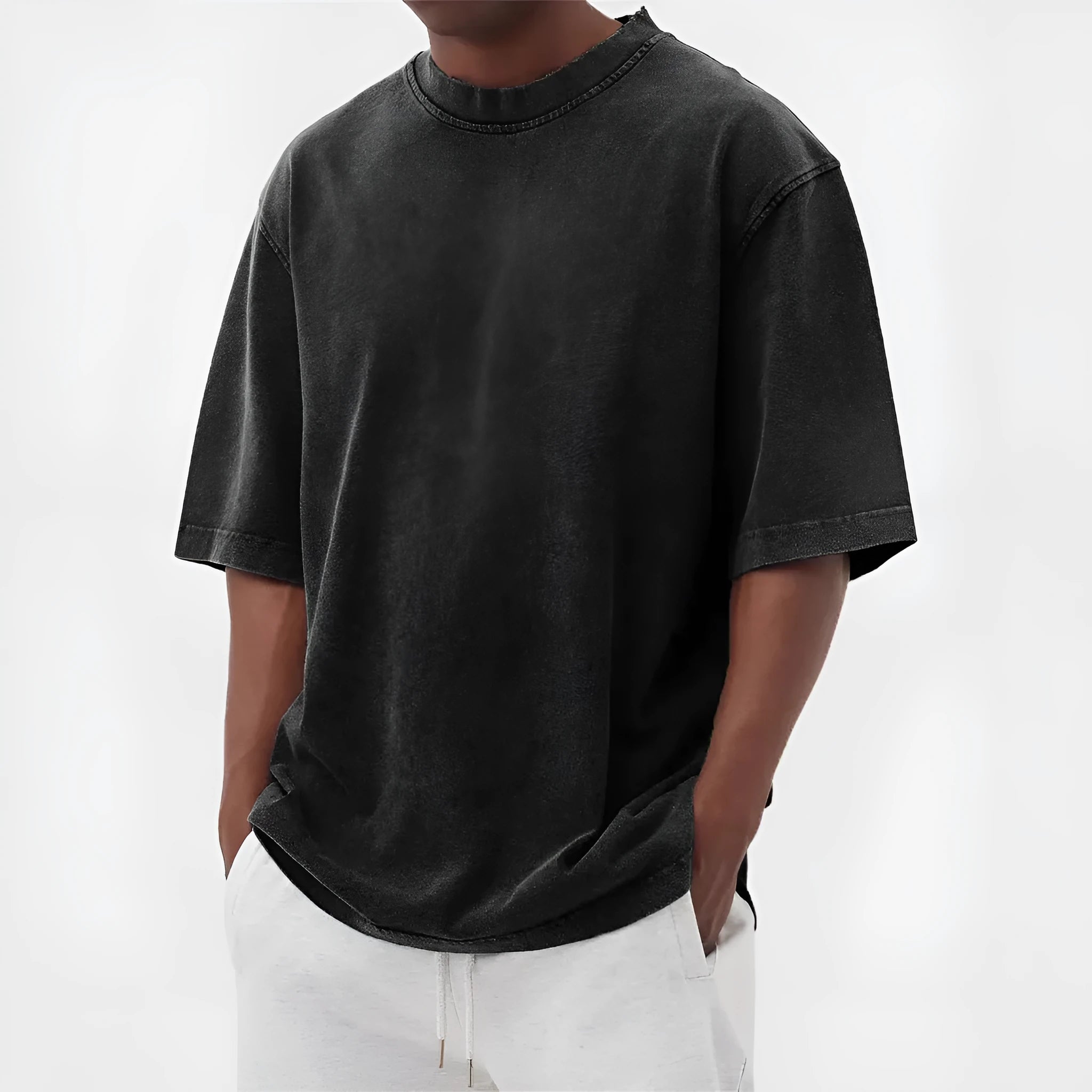 Man wearing a loose-fit, distressed army green pullover T-shirt with half sleeves.