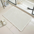 Checkered pattern non-slip absorbent bathroom floor carpet in beige colour.