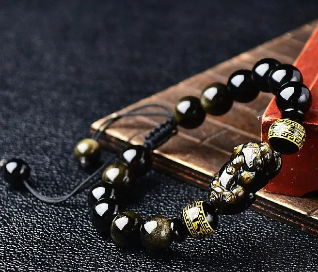 Hand-woven golden obsidian Pi Xiu bracelet with zodiac animal design in Chinese style