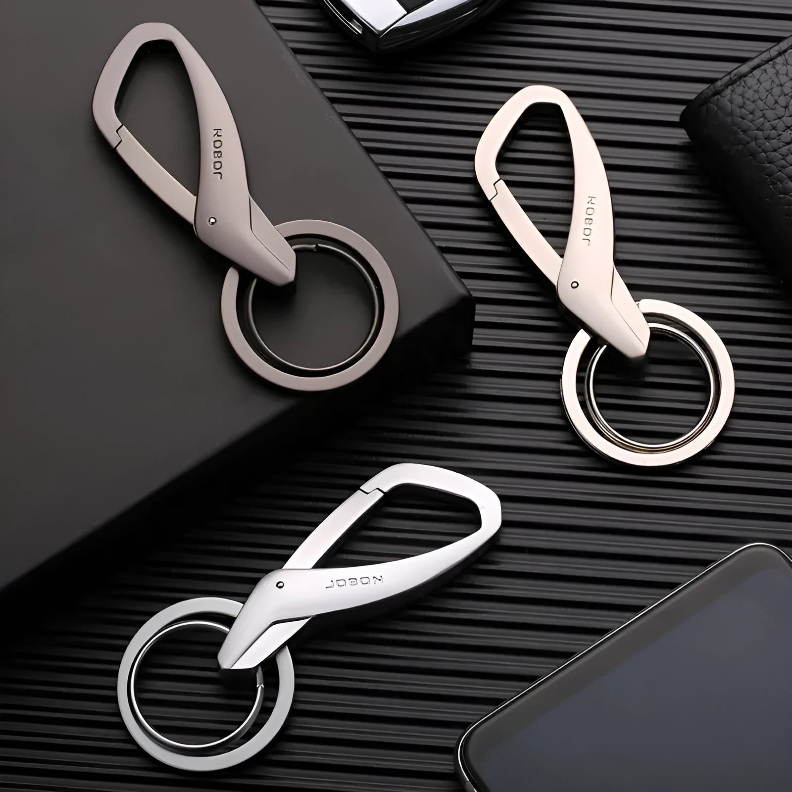 Zinc alloy double ring keychain for car keys in black, chrome, and nickel finishes.