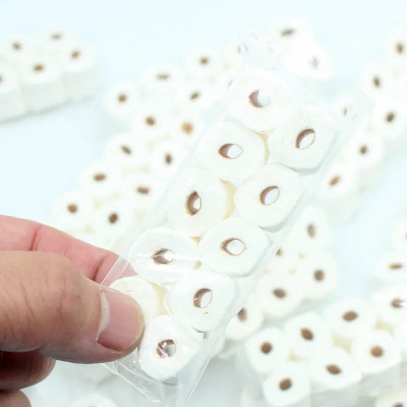 Miniature paper tissue roll model measuring 30mm wide by 15mm deep by 80mm high