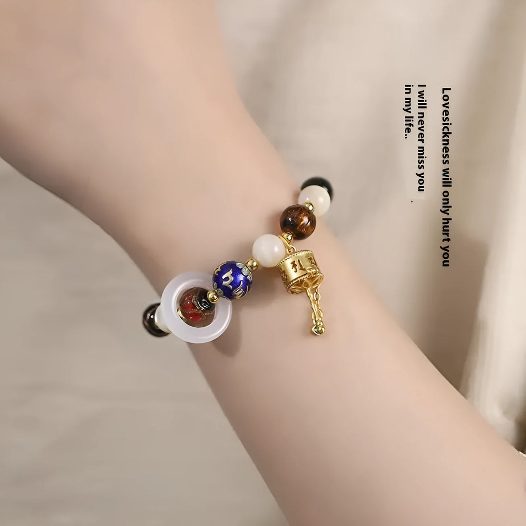Hand-woven women's bracelet with fragrant grey coloured glaze and round beads