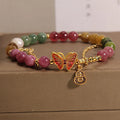 Natural jade coloured agate bracelet with butterfly-gourd tourmaline detail for women.