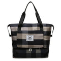 Foldable travel duffel bag in black with waterproof Oxford cloth, 20-35L capacity, and dry wet separation feature