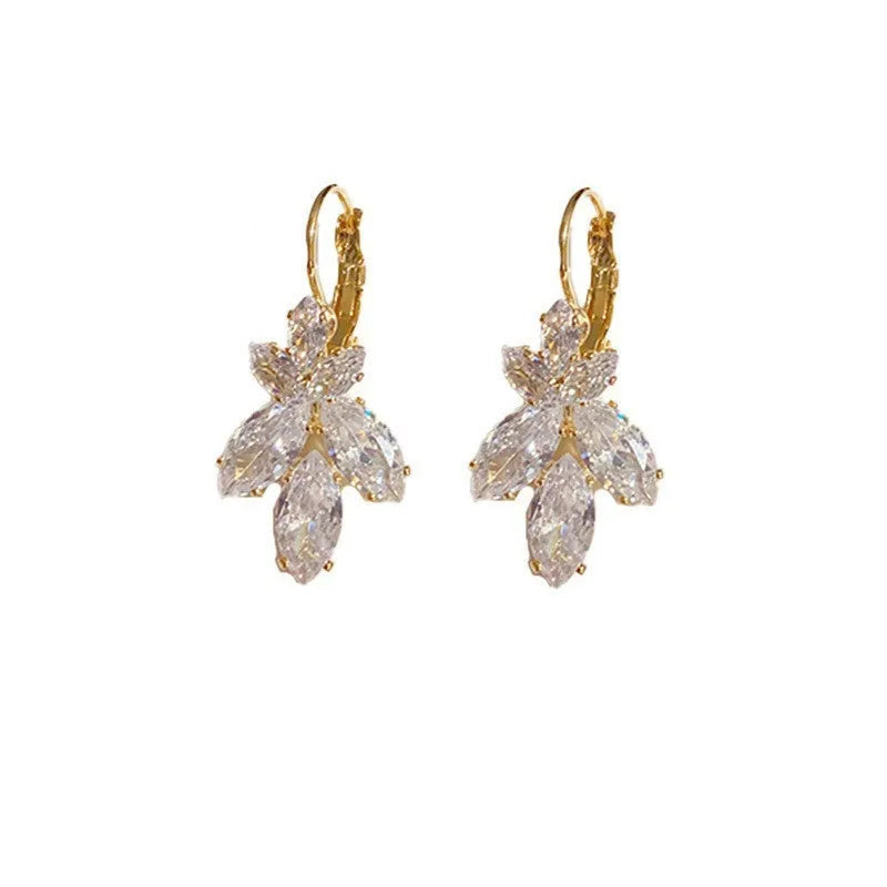 Platinum colour leaf earrings with shiny inlaid zircon stones