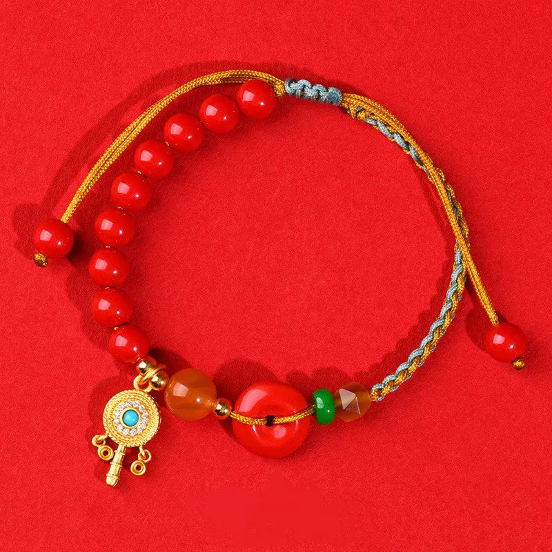 Hand-woven cinnabar peace blessing bracelet with buckle closure in emperor red sand colour