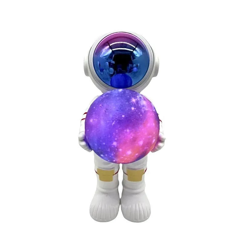 Spaceman starry sky projection lamp with astronaut holding moon design in fantasy painted finish