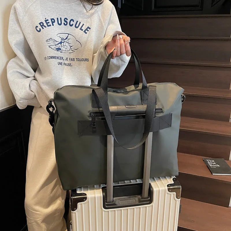 Lightweight oxford cloth tote bag in black, grey, or champagne for business travel.
