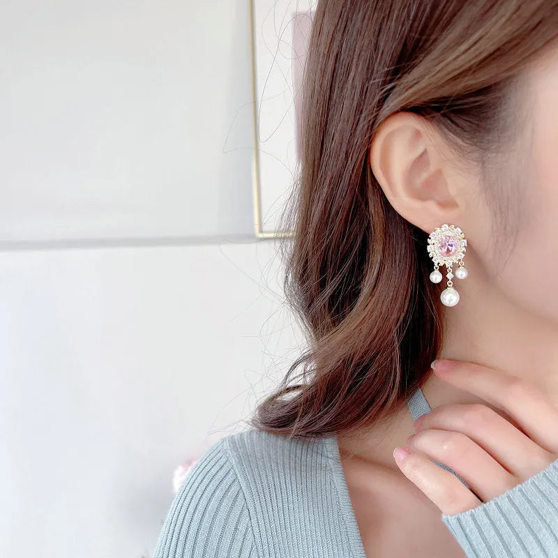 Oval geometric earrings with zircon inlaid details and pearl-accented tassel drop in light purple