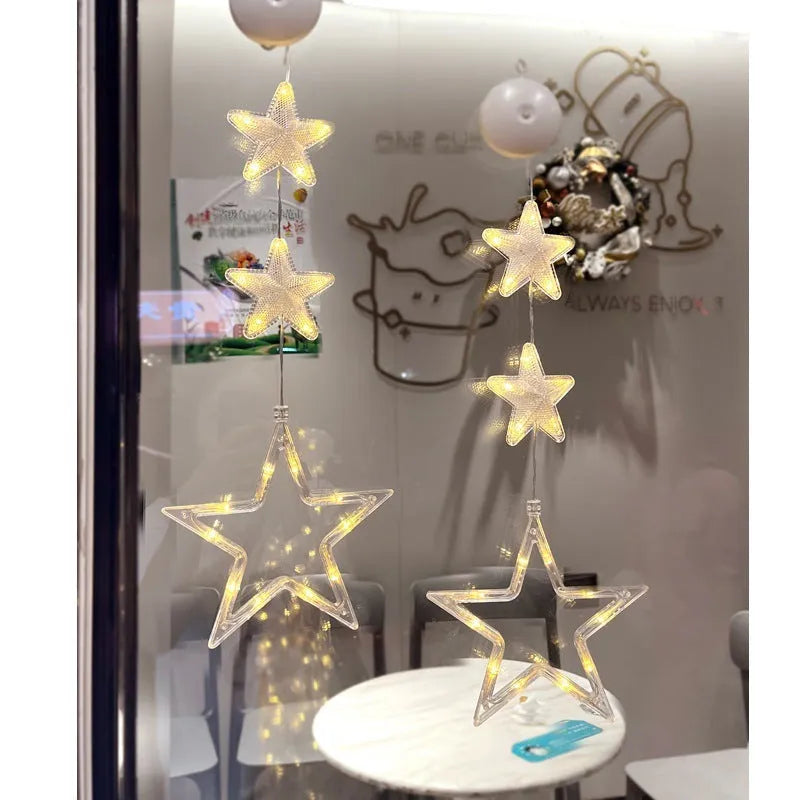 Christmas LED window light with suction cups showing deer, bell, and tree designs