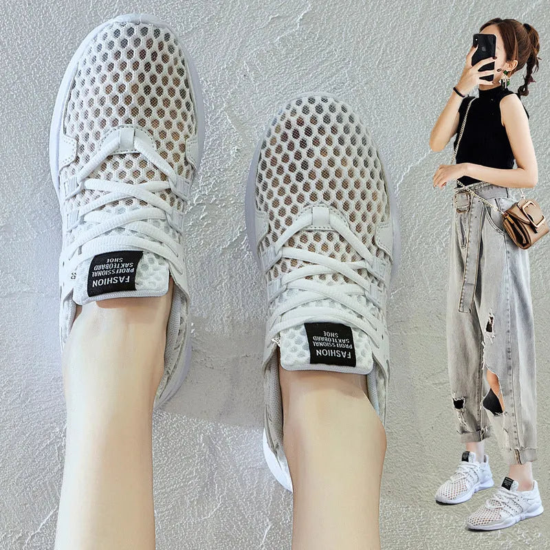 Breathable hollow out mesh casual sneakers in black and white colours with round toe design