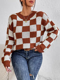 Dark brown plaid pattern long sleeve pullover sweater on a hanger.