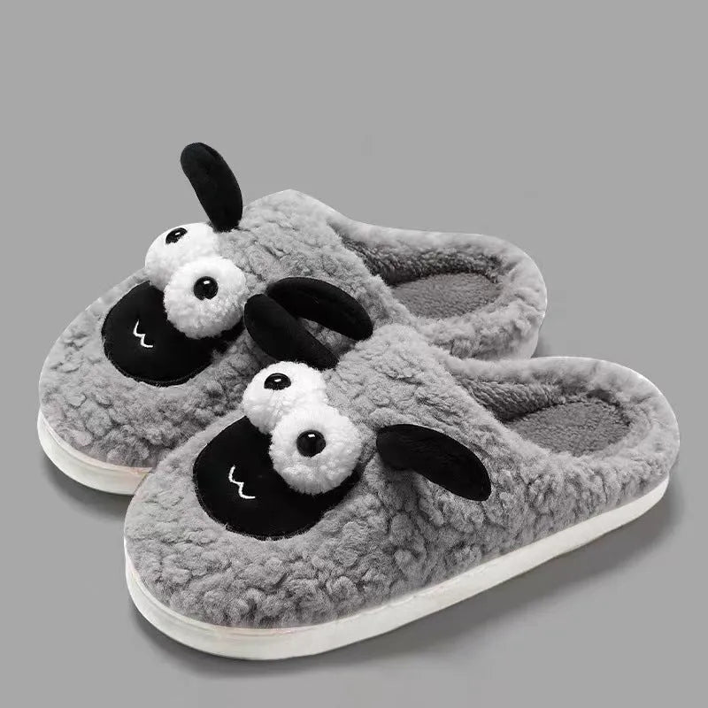 Brown lamb thermal cotton slip-on slippers with suede upper on a wooden floor.