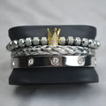 Pineapple ball crown twist woven mesh bracelet set in gold finish on white background