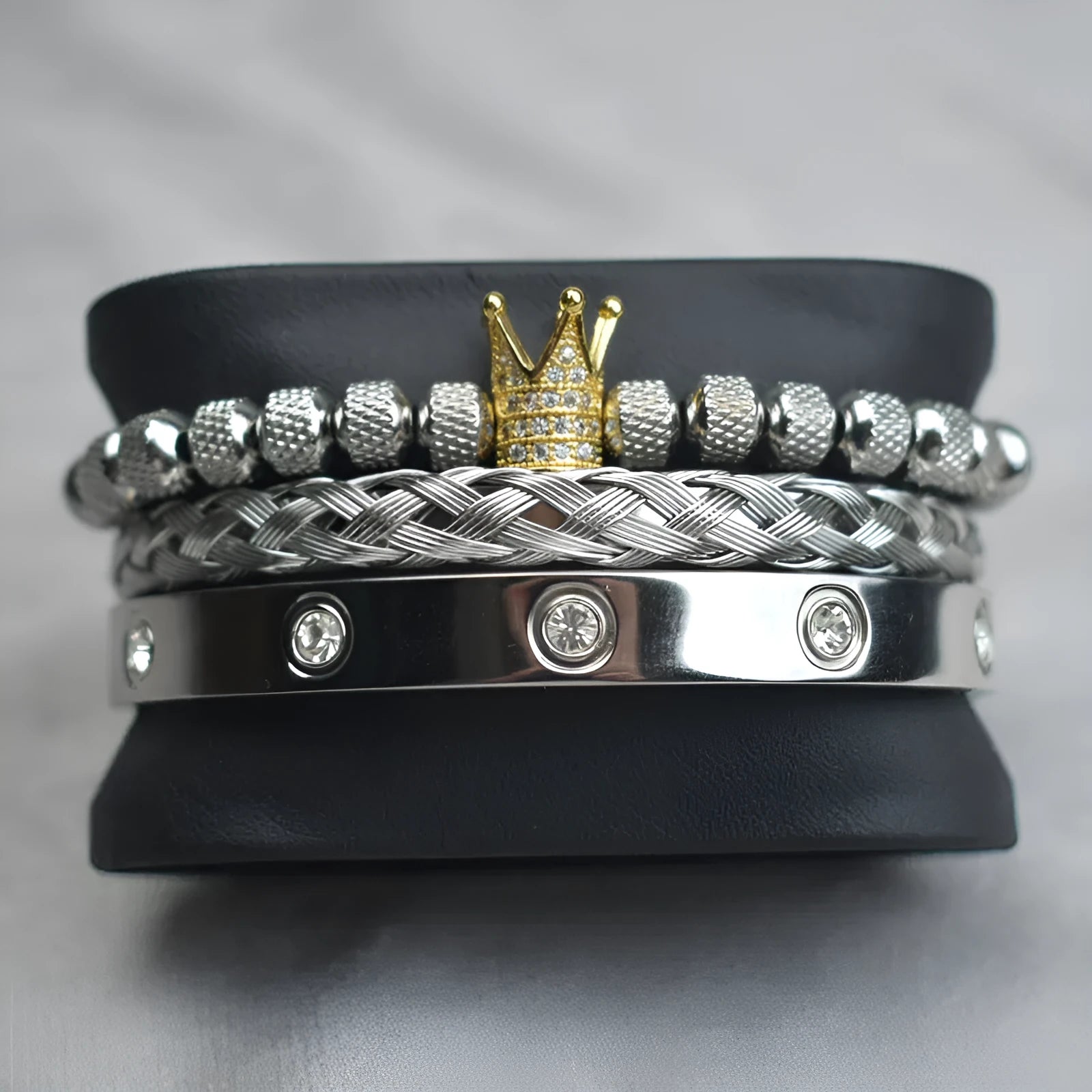 Pineapple ball crown twist woven mesh bracelet set in gold finish on white background