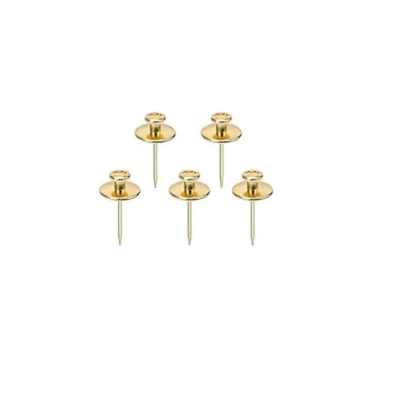 Fancy thumb tack set in mixed colours black gold silver bronze on a corkboard surface