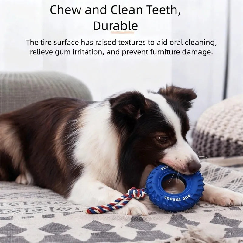 Rubber tire dog chew toy with cotton rope handle for tug of war and treat dispensing, in black, blue, or orange