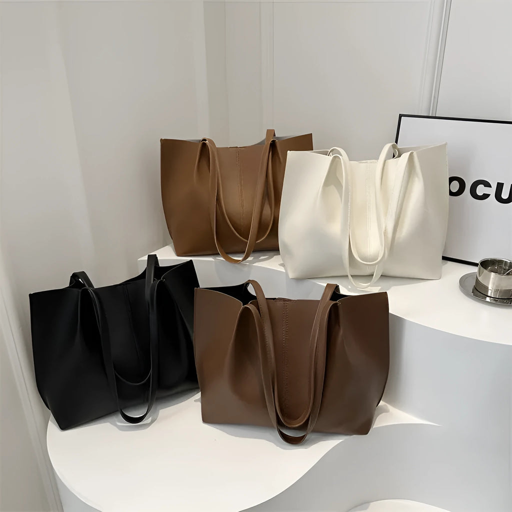 PU leather messenger bag in bucket shape with stitching detail, black colour, double shoulder straps, open pocket outer