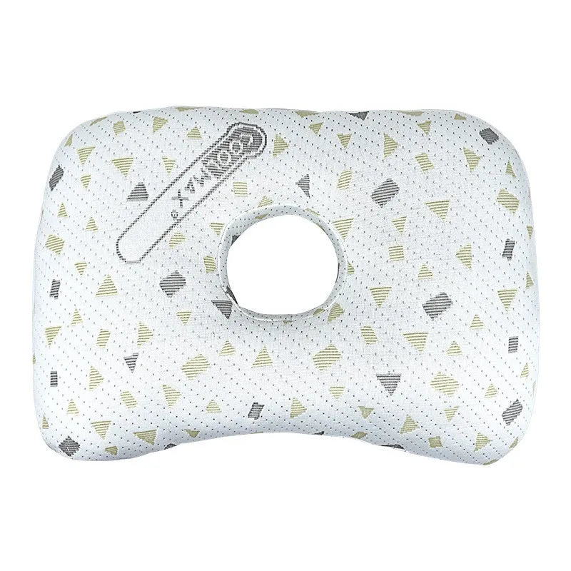 Beauty salon single hole ear pillow in Boer Grey colour on a treatment bed.