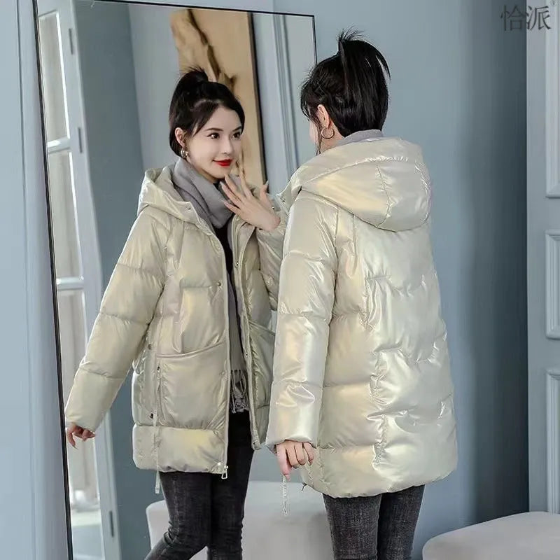 A woman's loose-fit hooded winter jacket in a thick fabric, shown in a choice of colours.