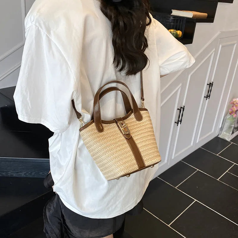 Women's bucket handbag in PU with sewing line detail, available in brown and apricot colours