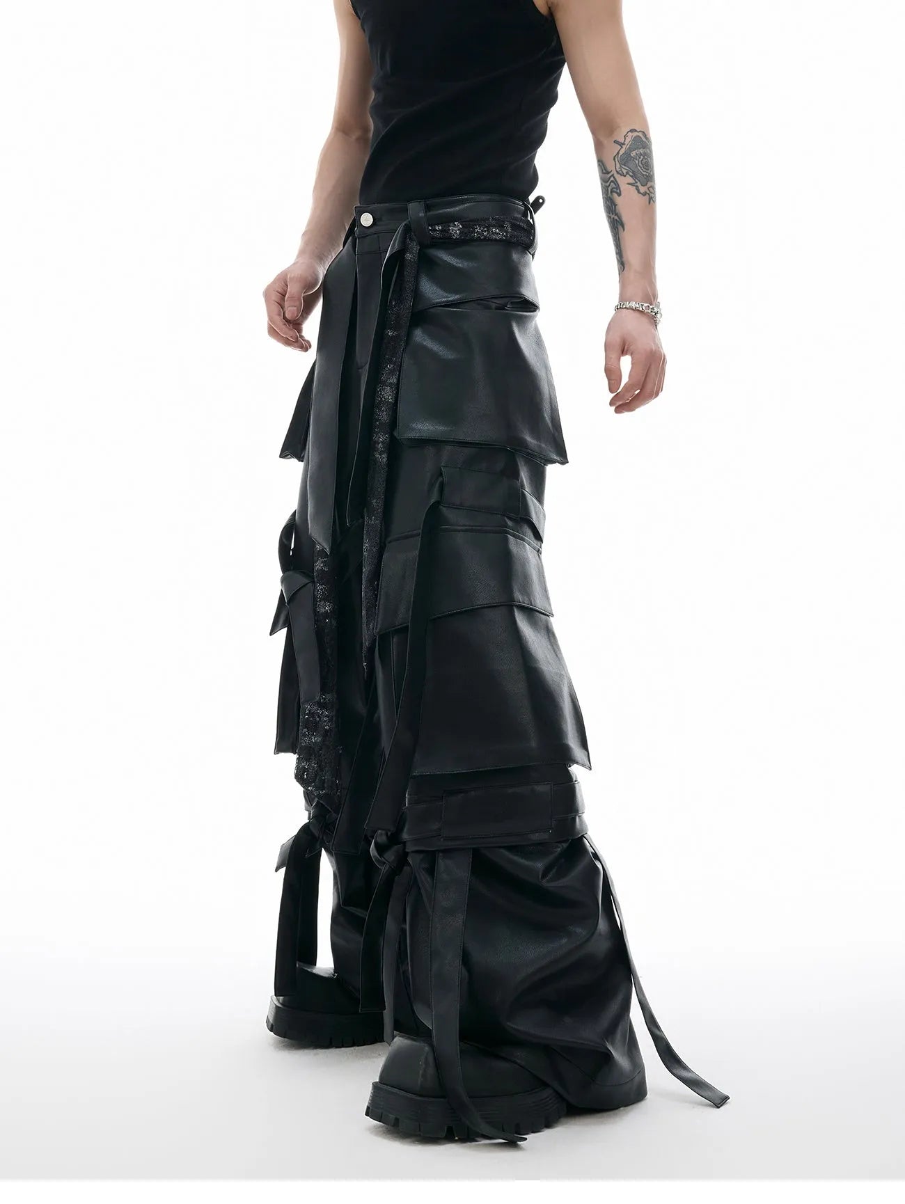 Black quilted loose-fit trousers with multiple pockets and leather-like appearance