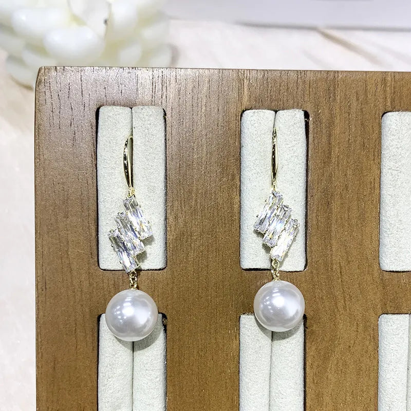 French micro inlaid diamond pearl hook earrings in gold finish