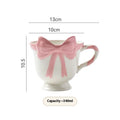 White ceramic mug with heart and bow design, 301-400ml capacity, bow-shaped handle