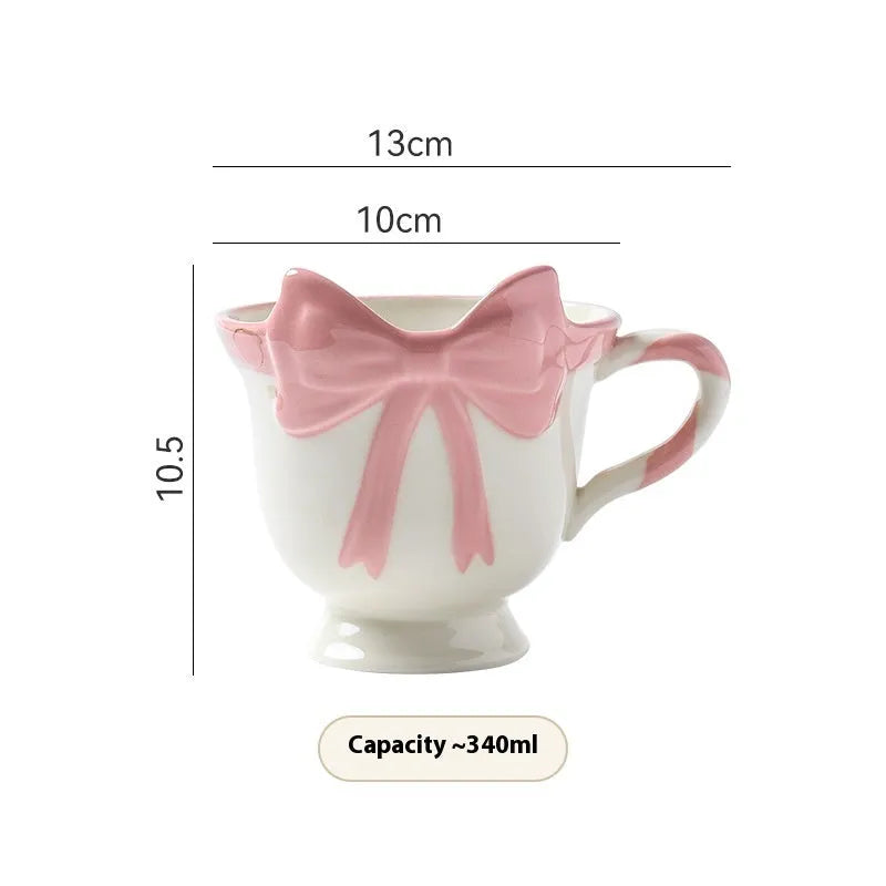 White ceramic mug with heart and bow design, 301-400ml capacity, bow-shaped handle