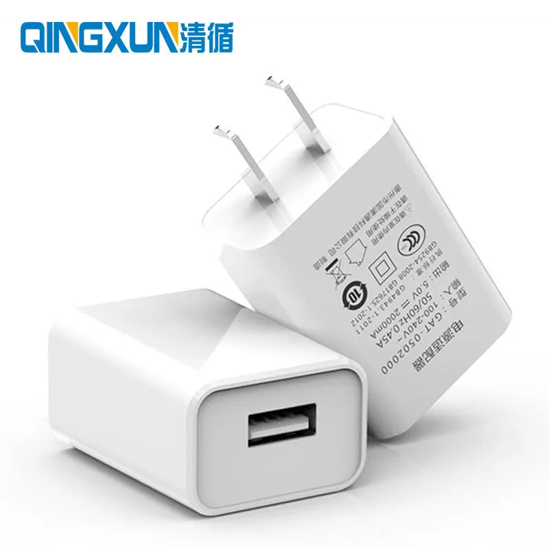 5V1A charging head power adapter with UK plug, USB cable, and power line set on a white background.