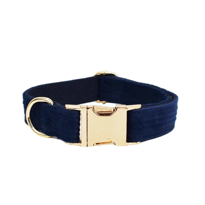 Navy blue corduroy dog collar and leash set with matching bow, vest, and poop bag