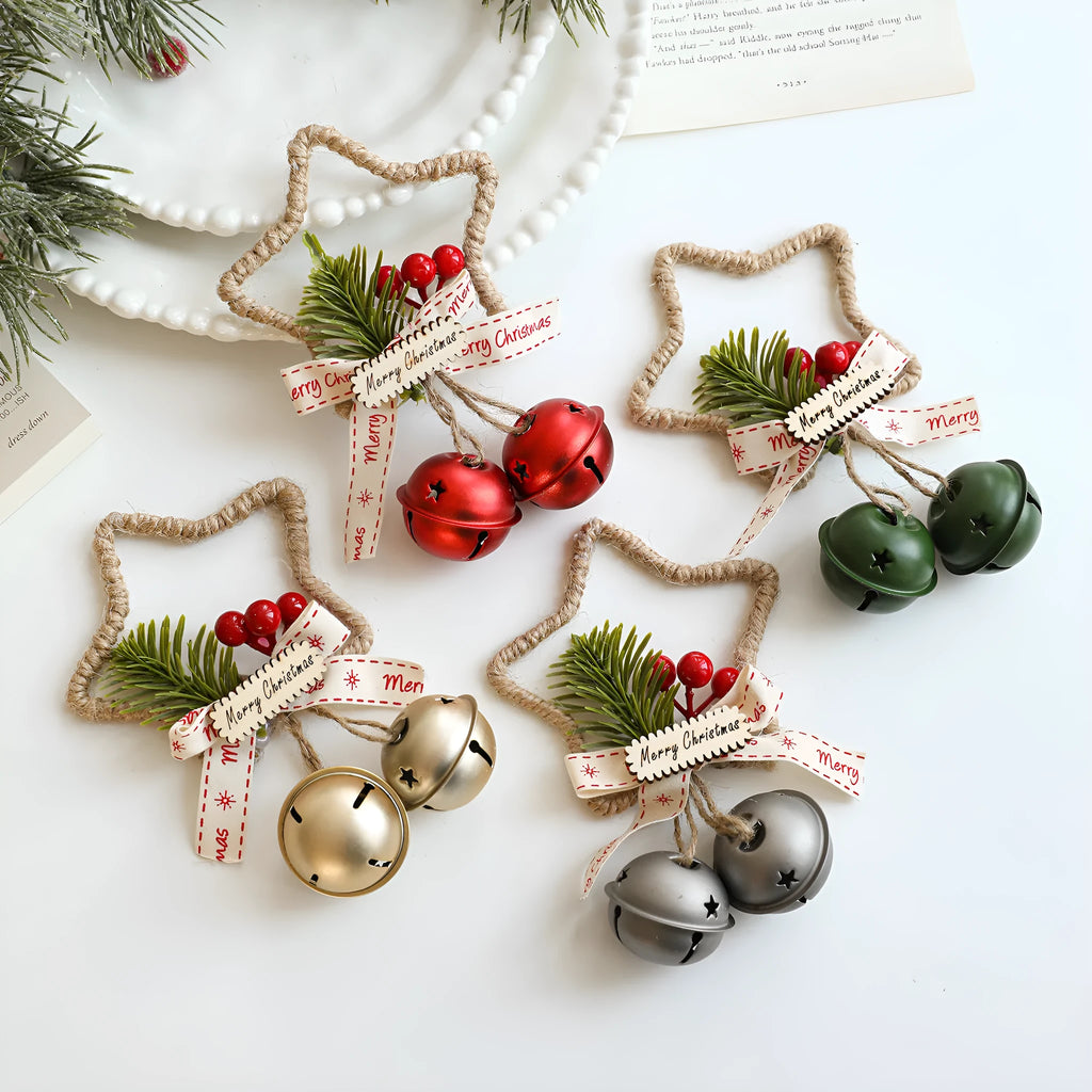 Iron Christmas bell ornament in gold hanging on a Christmas tree branch