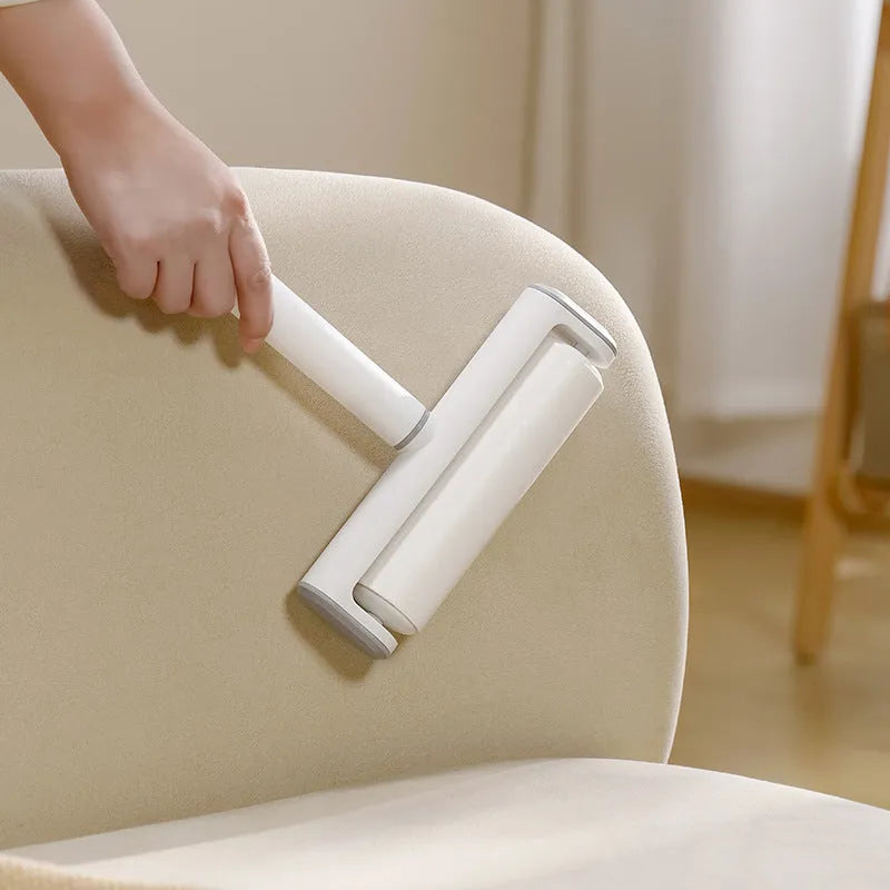Long-handle lint roller with removable adhesive head for picking up pet hair from floors and furniture