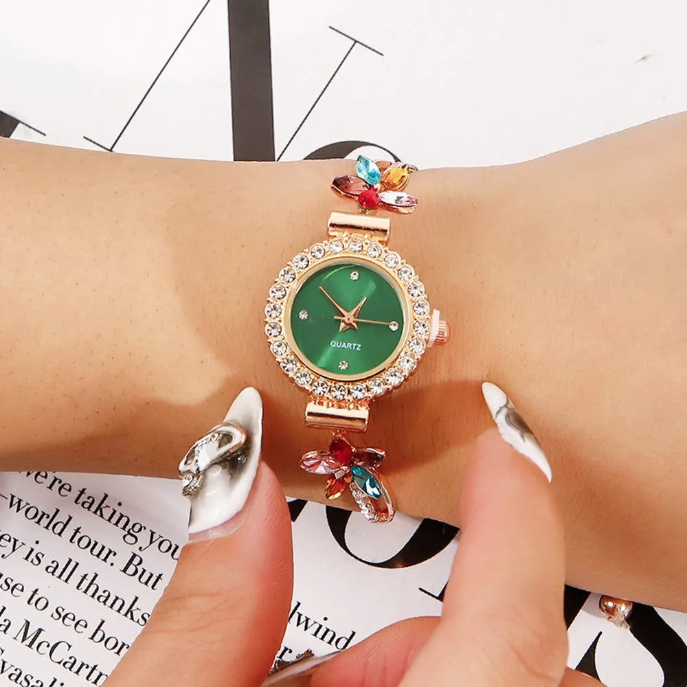 Round women's quartz watch on alloy bracelet with diamond accents and gold finish