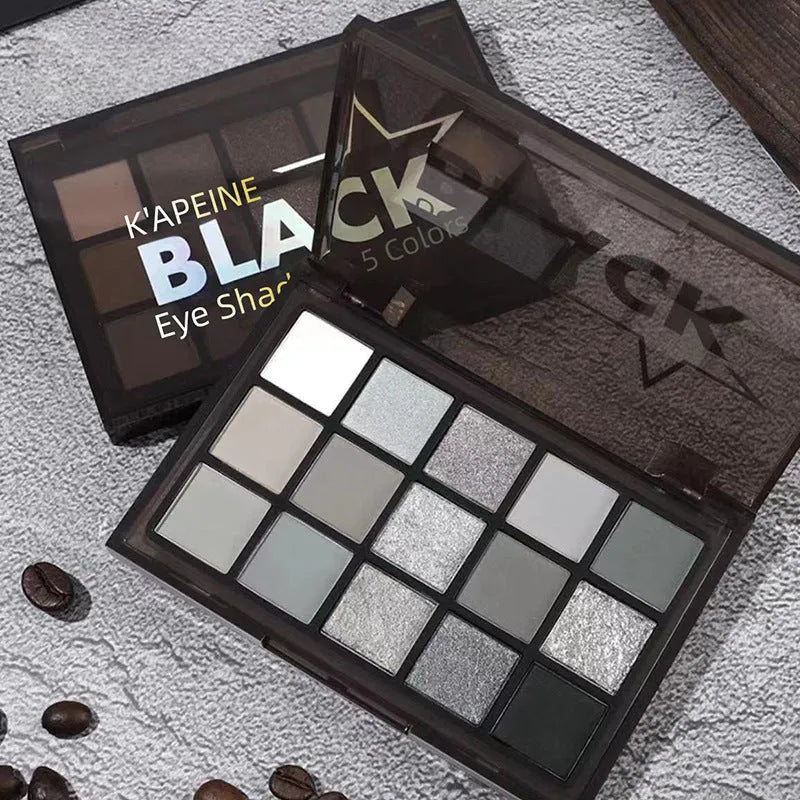 15-colour eyeshadow palette showing matte and shimmer pans including grey-black smokey shades
