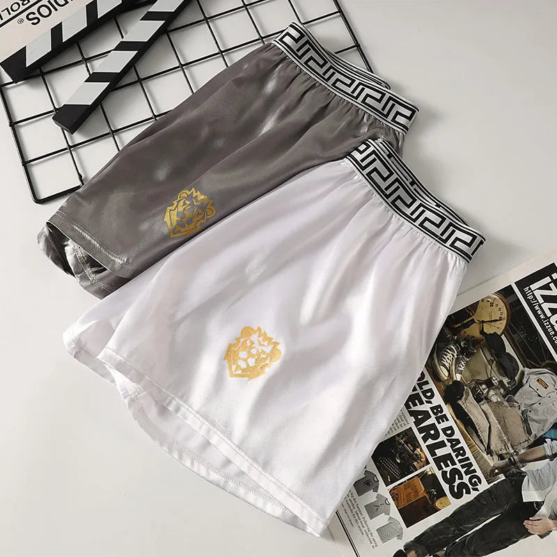 Solid colour men's loose fit knitted polyester boxer shorts in silver grey on white background