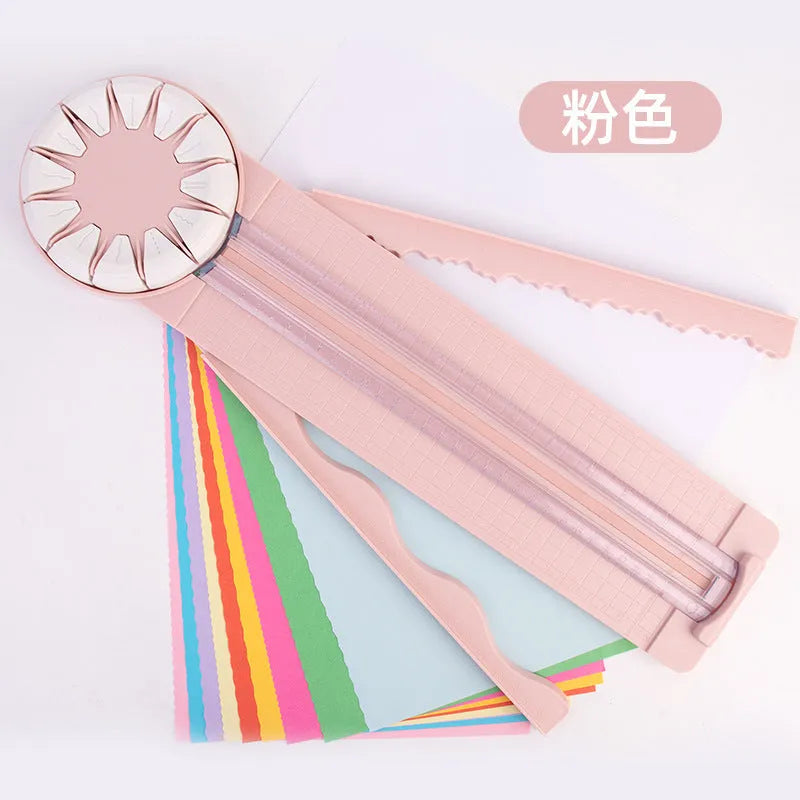 Pink and black 12-in-1 multifunctional plastic paper cutting machine on a desk