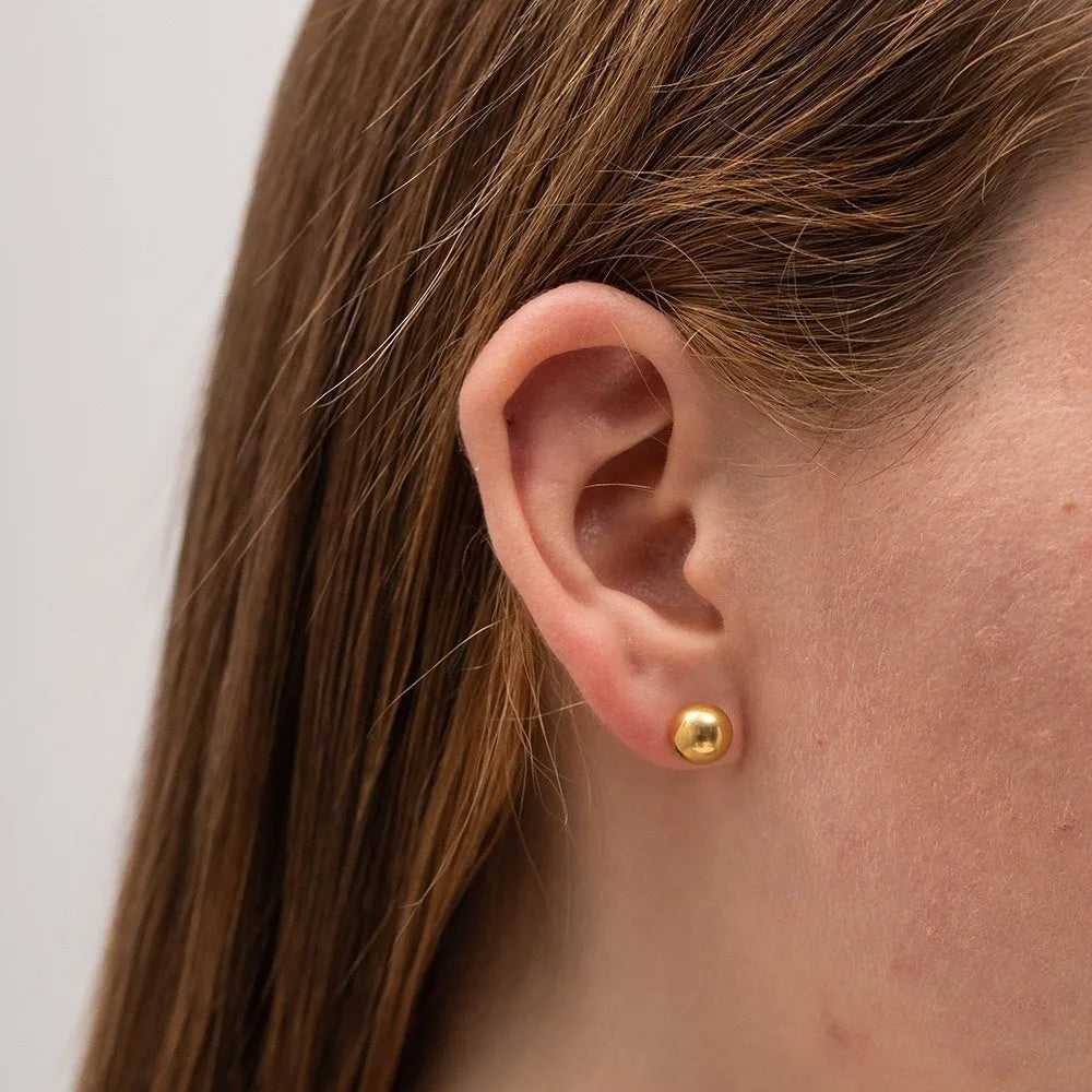 Titanium steel ball stud earrings with round geometric design in gold and silver electroplated finishes