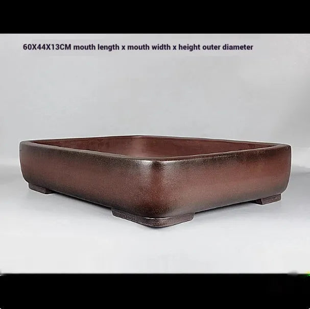 Handmade rectangular purple clay flower pot with antique finish showing internal planting space