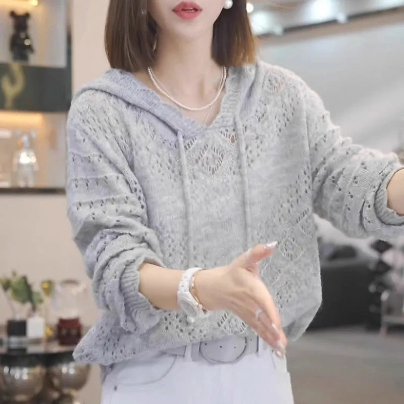 Women's loose-fitting blue crochet hooded longsuit undershirt with long sleeves.