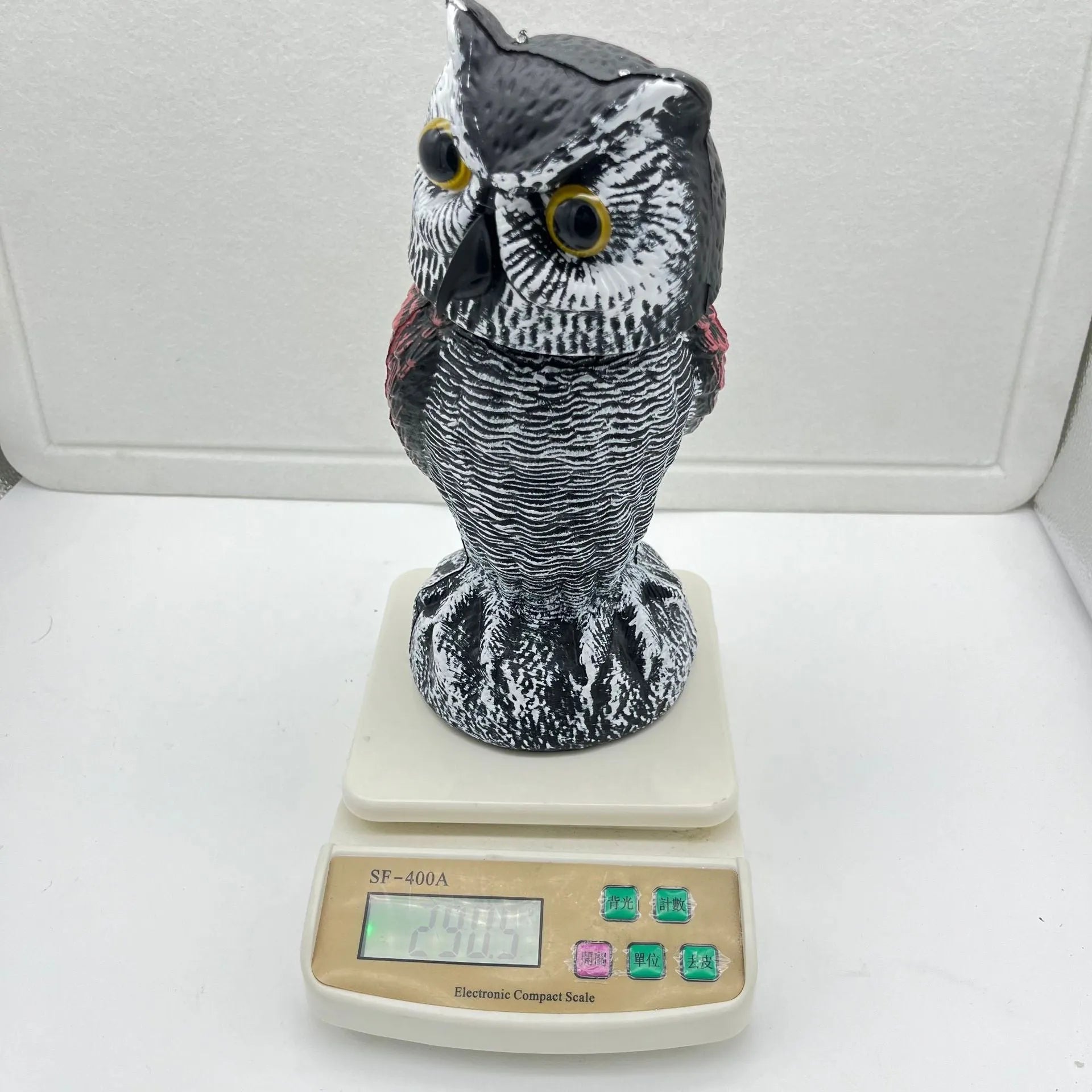 Artificial owl bait ornament with shaking head mechanism for outdoor bird deterrent