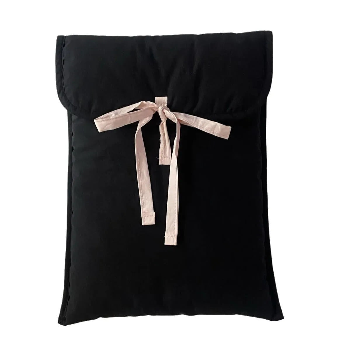 Black and white quilted women's laptop bag with a large decorative ballet bow on the front.