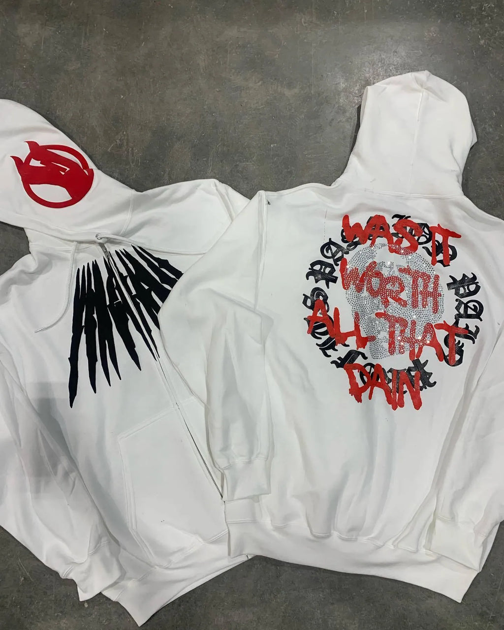 Black hooded sweatshirt with white skull print and rhinestone details in loose cardigan style