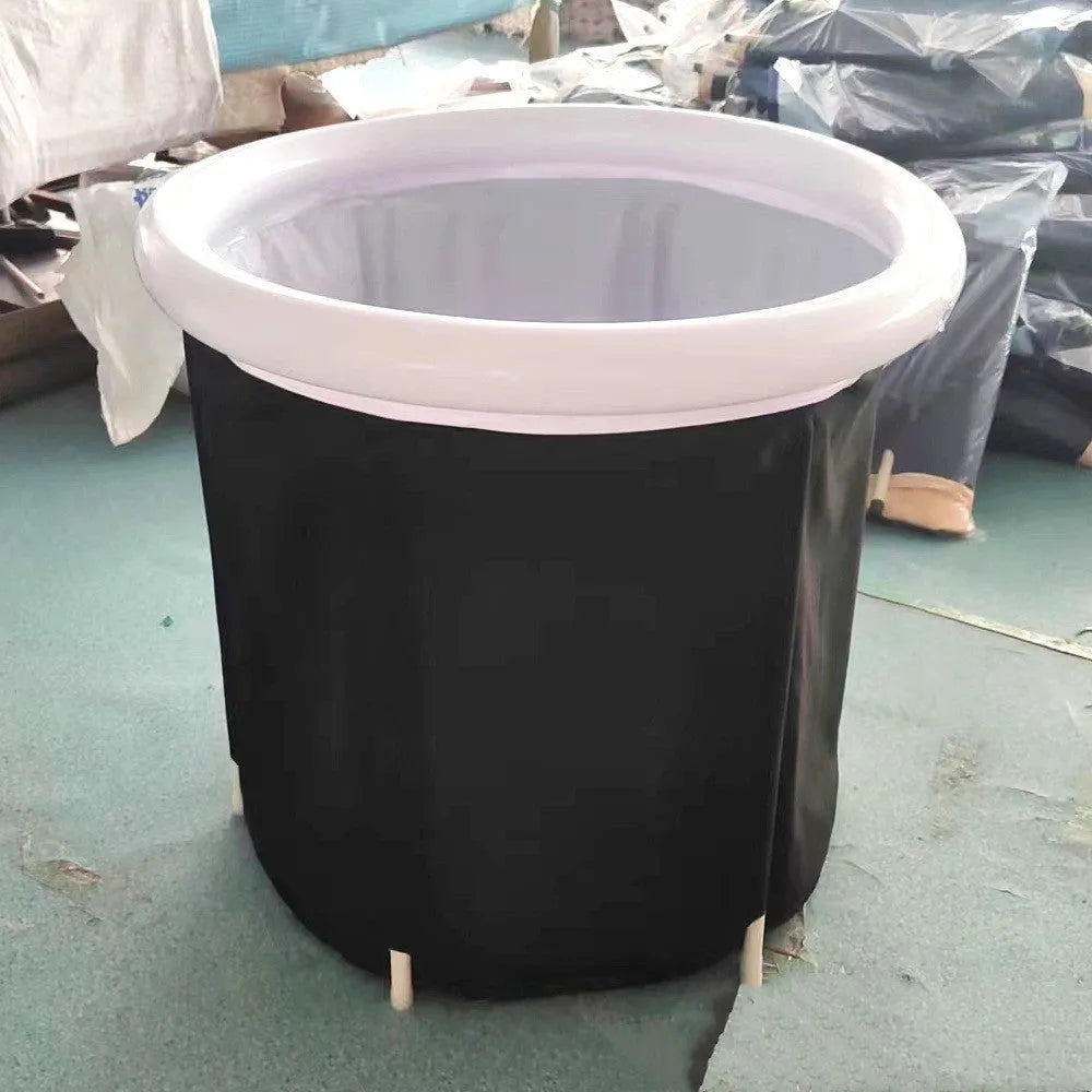 Black inflatable portable ice bath tub with insulation, shown with weather lid and pump.